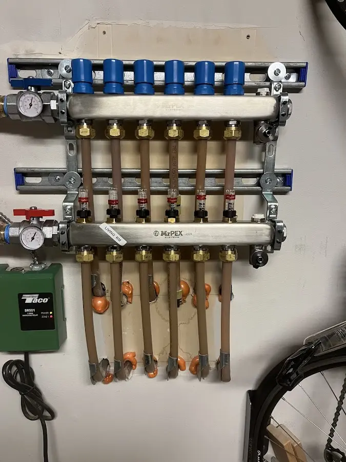 Plumber performing Gas Line Installation at a residential property in King